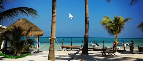 Private beach, sun loungers, beach towels, beach massages