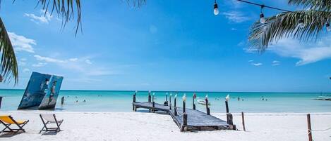 Private beach, sun loungers, beach towels, beach massages