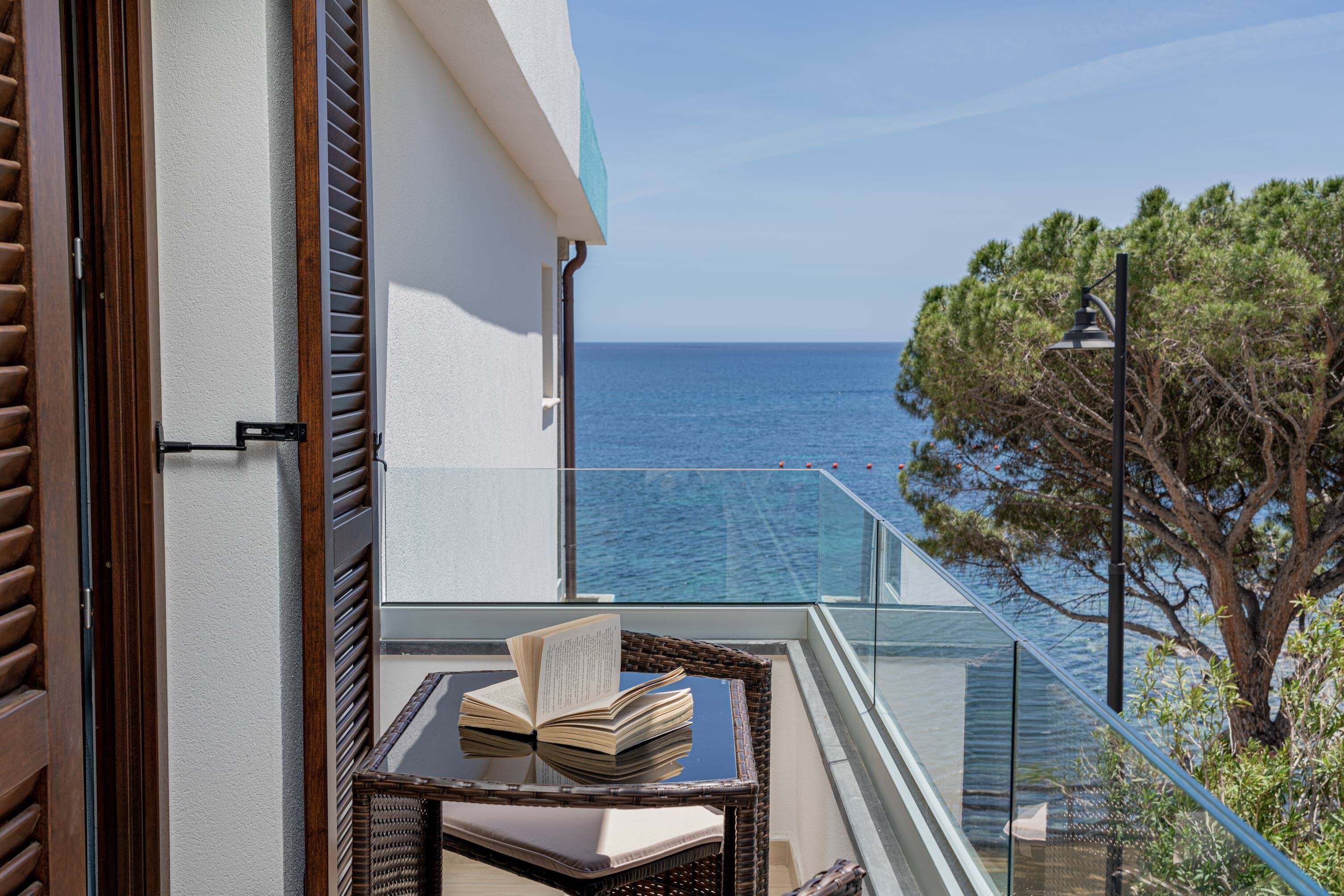 comfort room, 2 bedrooms, balcony, partial sea view | minibar, individually decorated, individually furnished, desk