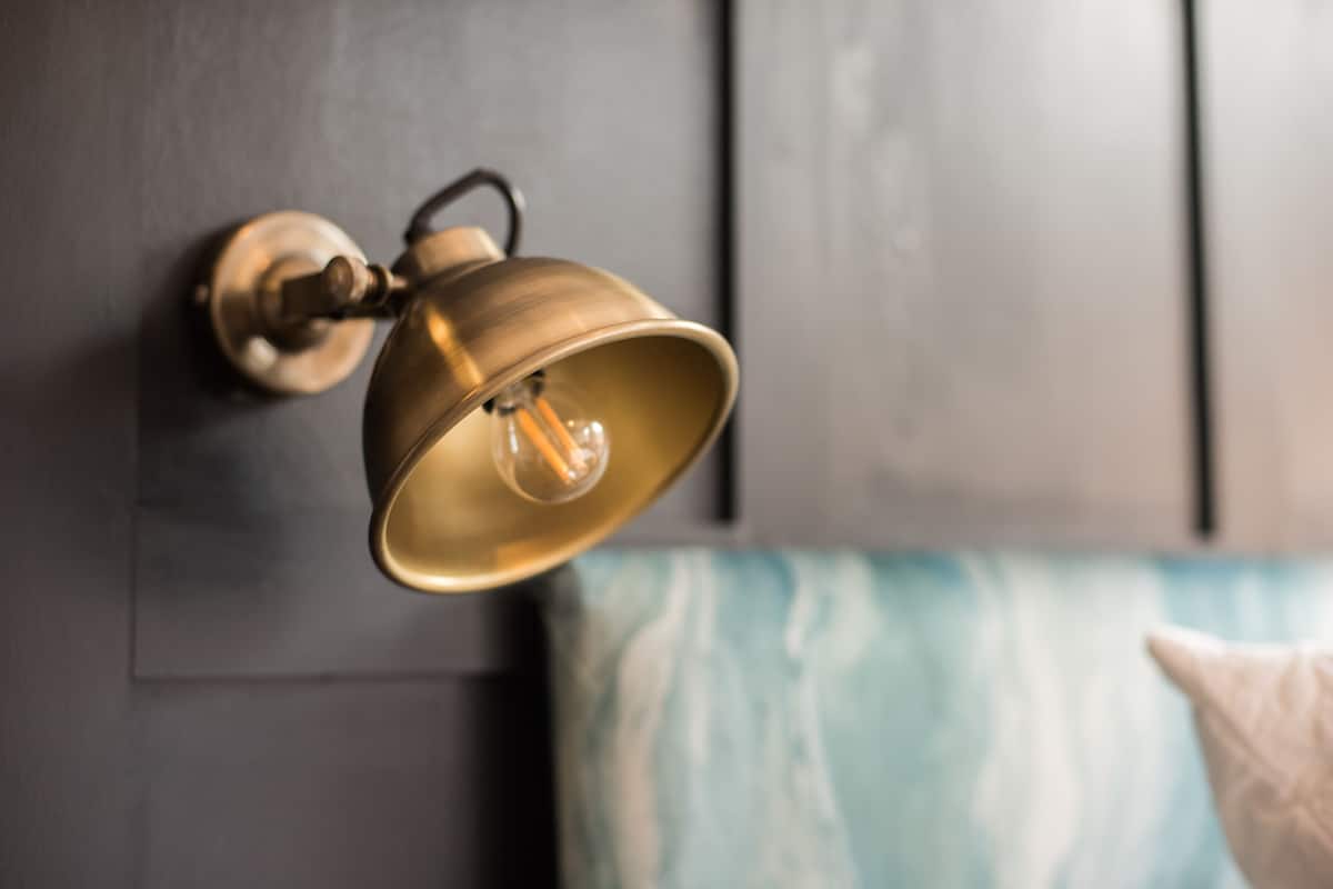 A wall-mounted light fixture with a visible bulb.