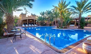 Outdoor pool, free pool cabanas, pool umbrellas