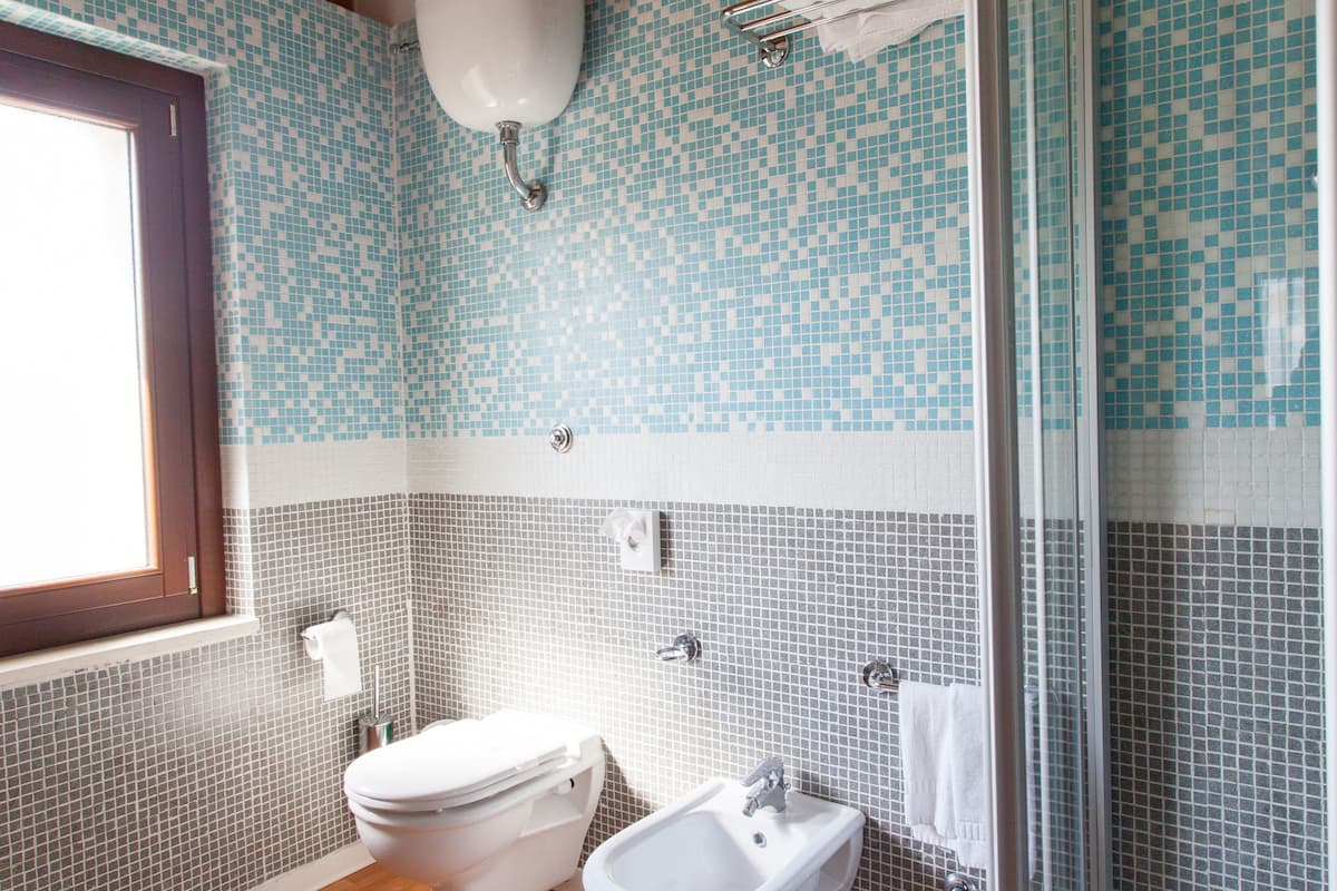 superior double room, multiple beds | bathroom | shower, hair dryer, bidet, towels