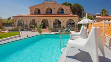 Outdoor pool, pool umbrellas, pool loungers