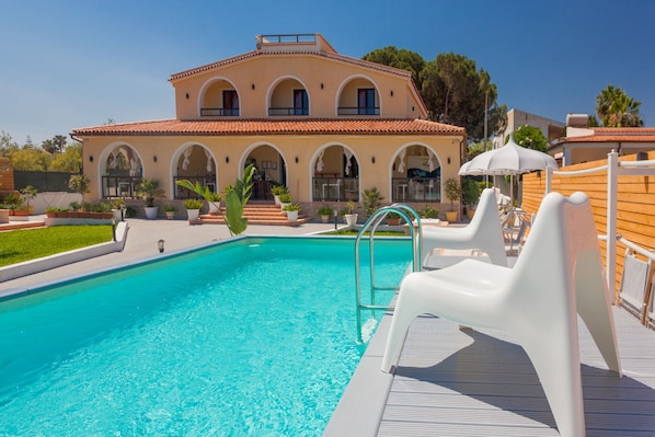 Outdoor pool, pool umbrellas, pool loungers