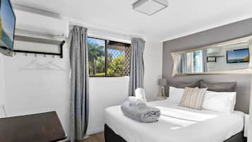 Small 15sq, Queen Room | Living area | 40-inch TV with digital channels