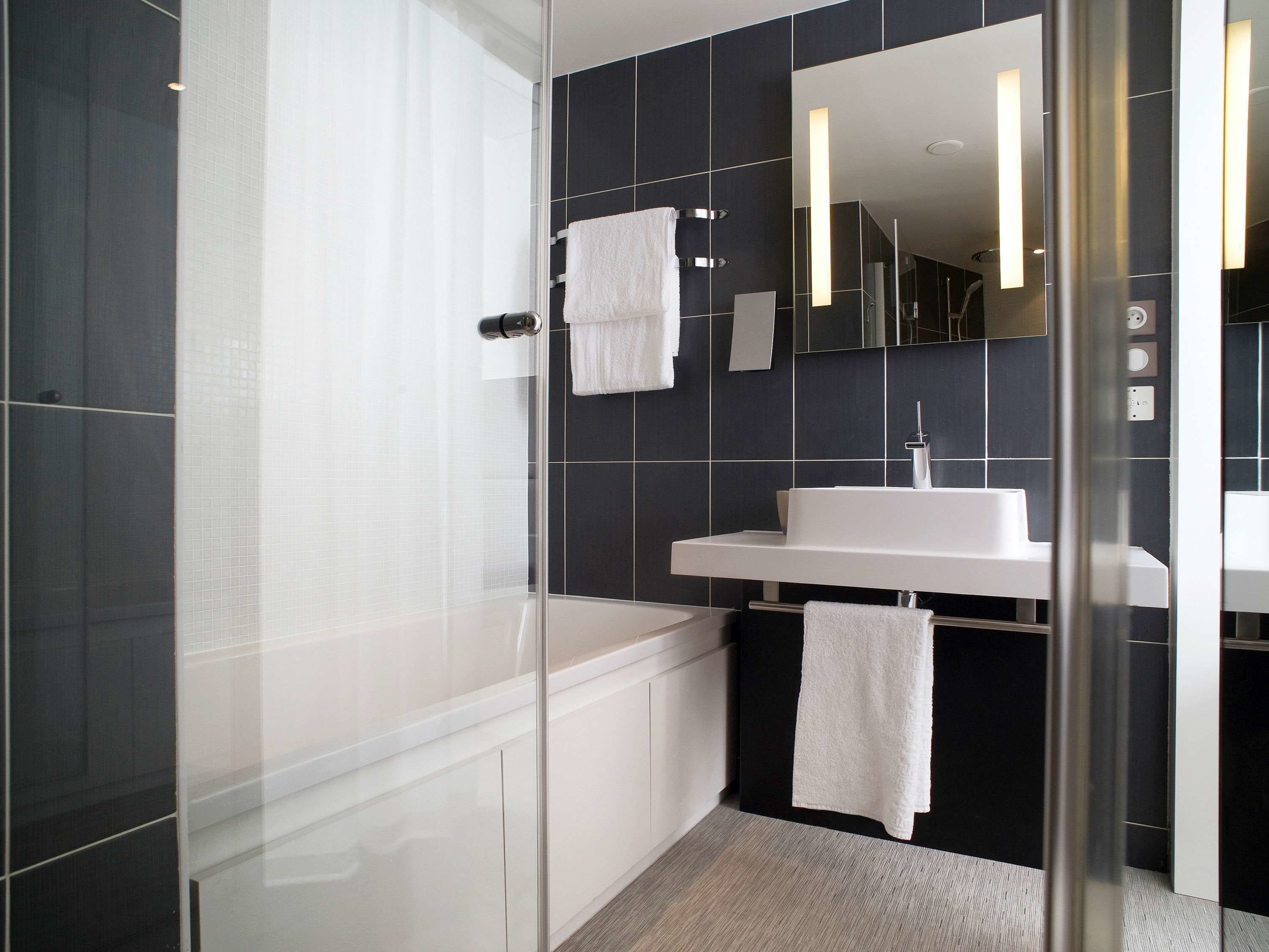 separate bathtub and shower, deep-soaking bathtub, rainfall showerhead