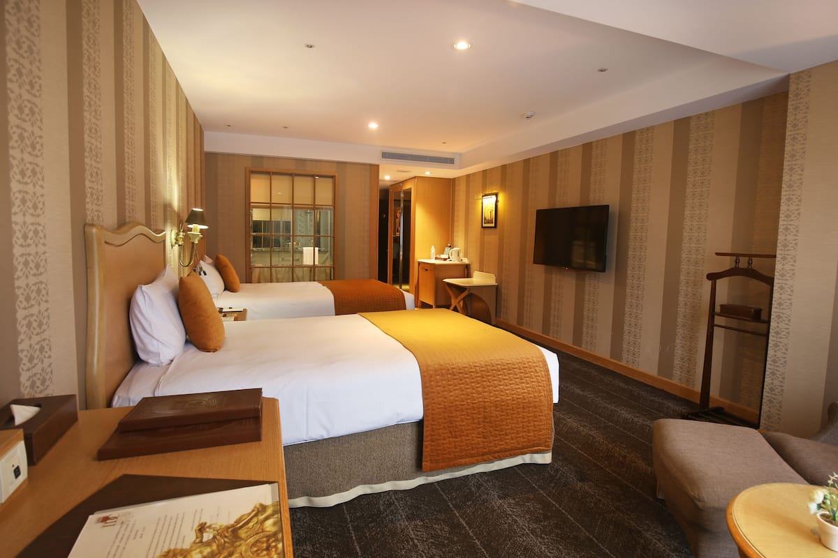 premier twin room | premium bedding, down duvets, in-room safe, desk