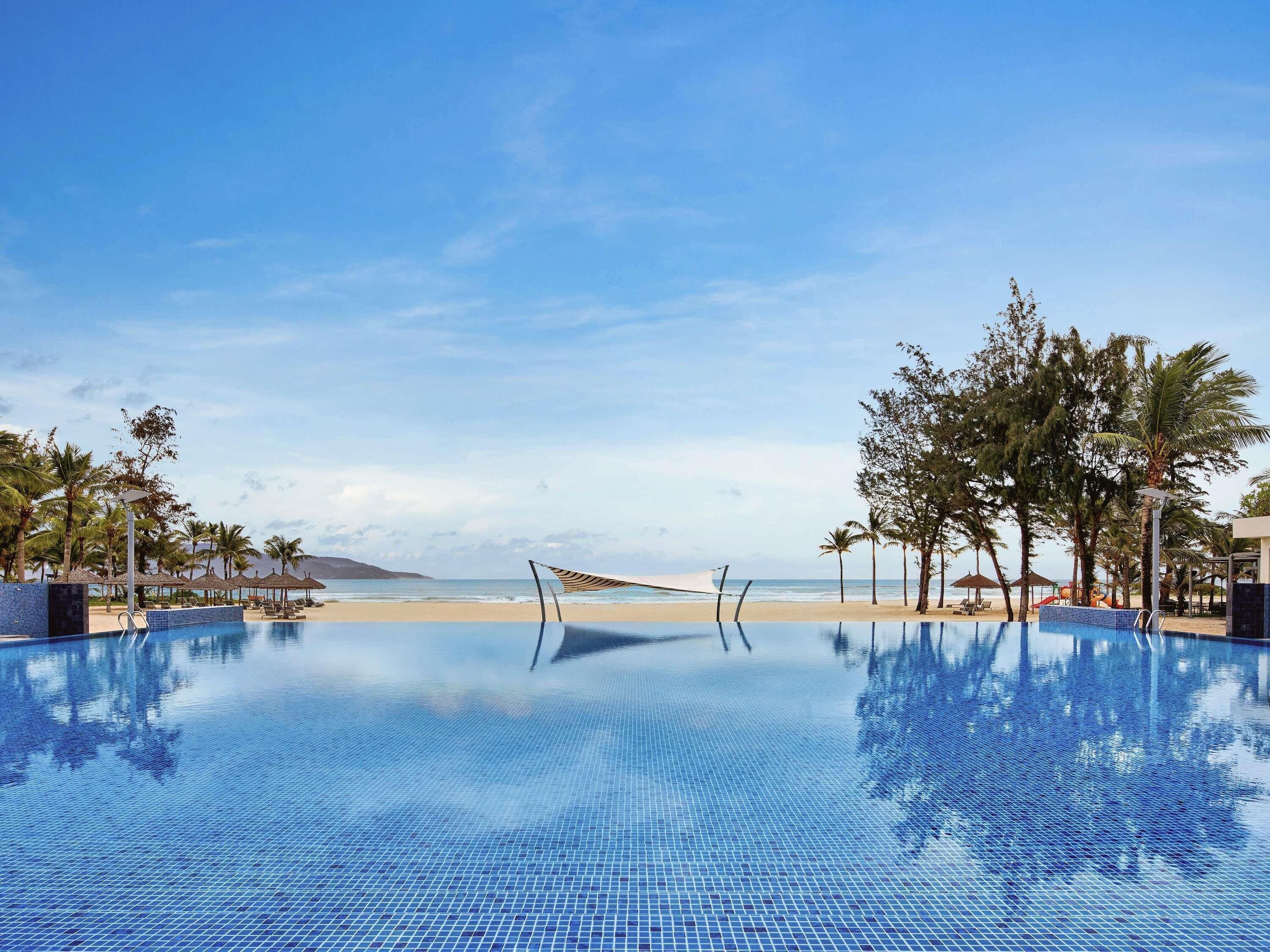 Outdoor pool, open 5:00 AM to 9:00 PM, pool umbrellas, pool loungers