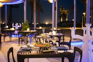 2 bars/lounges, poolside bar, beach bar