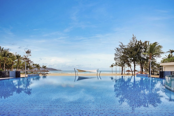 Outdoor pool, open 5:00 AM to 9:00 PM, pool umbrellas, pool loungers