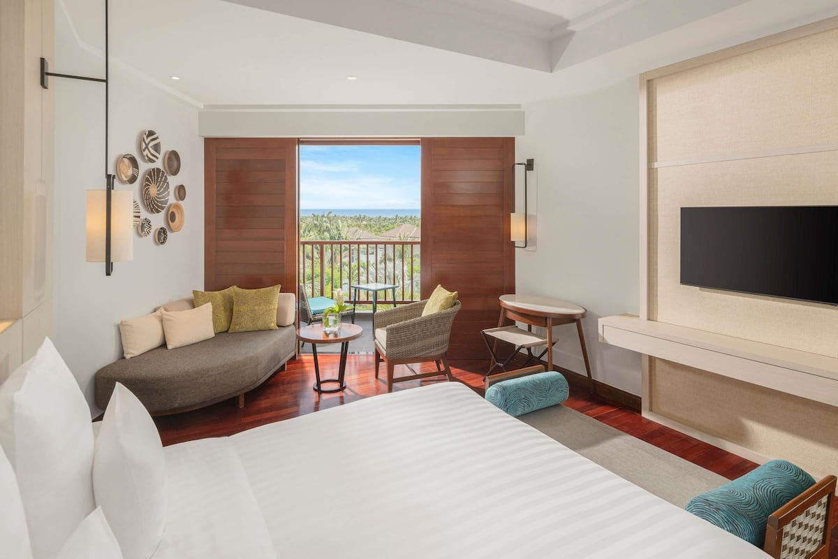 Deluxe Room, 1 Queen Bed, Partial Ocean View | Minibar, in-room safe, desk, laptop workspace
