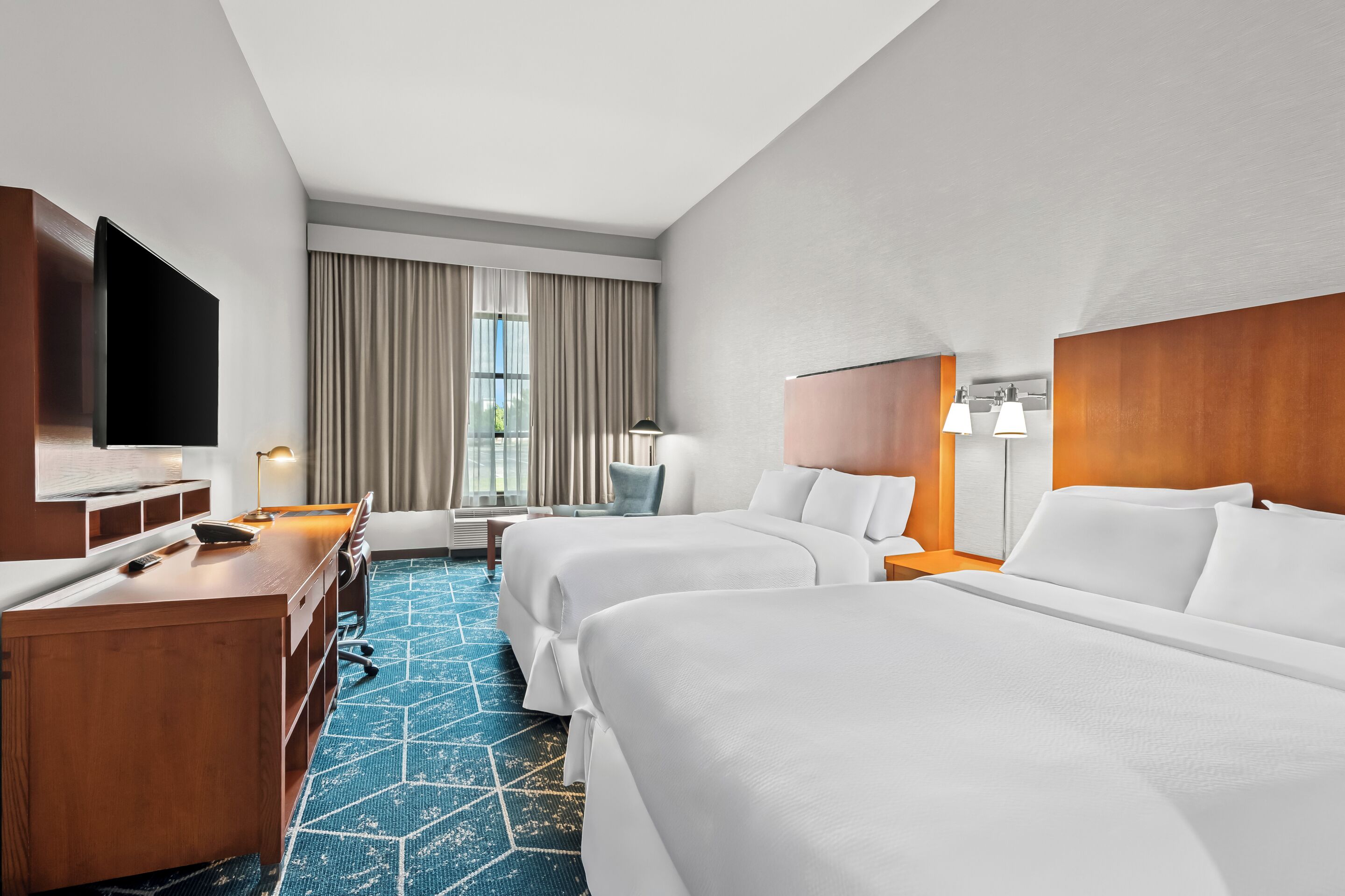 Down comforters, pillowtop beds, desk, blackout drapes