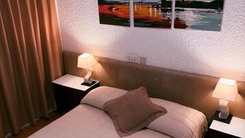 Habitación doble Deluxe, 1 habitación | Ropa de cama de alta calidad y minibar