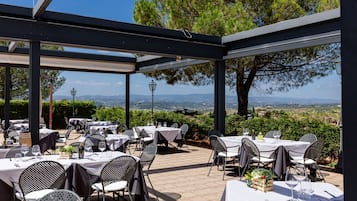 Lunch, dinner served; local cuisine, garden views