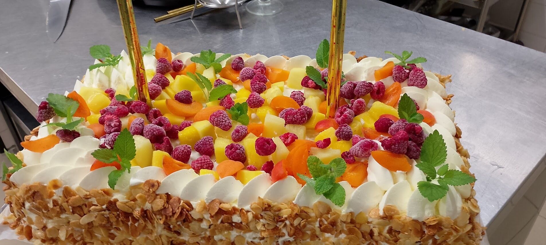 A dessert with fruit and nuts on a table.