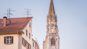 A historic street with traditional European architecture, including a church tower and various buildings with shuttered windows and balconies. - ibis Konstanz (Konstanz)