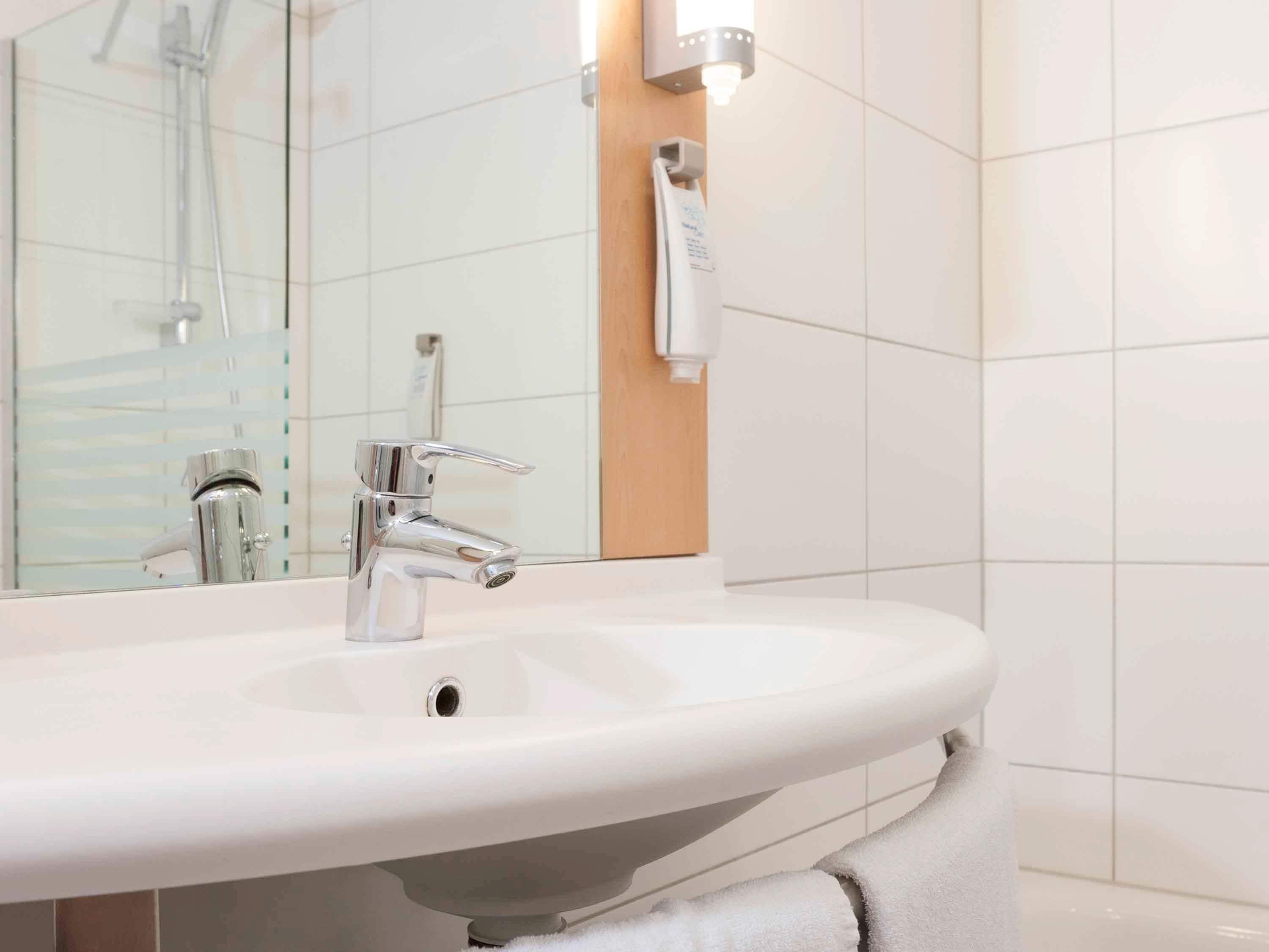 standard room, 1 double bed with sofa bed | bathroom | shower, eco-friendly toiletries, hair dryer, towels