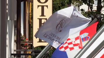 A hotel sign with a prominent "HOTEL" text and a logo.