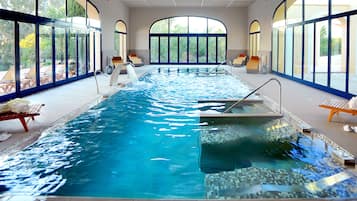 Indoor pool, pool umbrellas, pool loungers