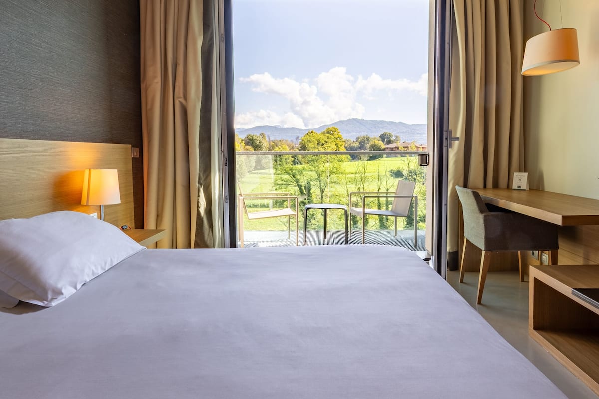 Premier Double Room Single Use | In-room safe, desk, laptop workspace, blackout drapes