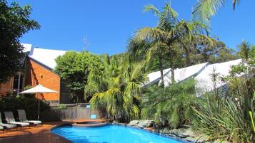 Outdoor pool, pool umbrellas, pool loungers