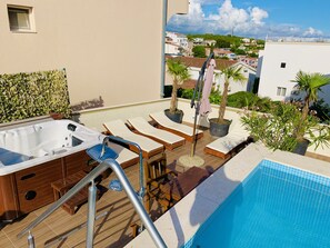 LCD TV, DVD player, iPod dock, first-run movies