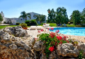 Seasonal outdoor pool, pool umbrellas, pool loungers