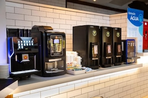 A coffee station with multiple coffee machines and a water dispenser. - La Torre Resort All Inclusive (Porto Seguro)