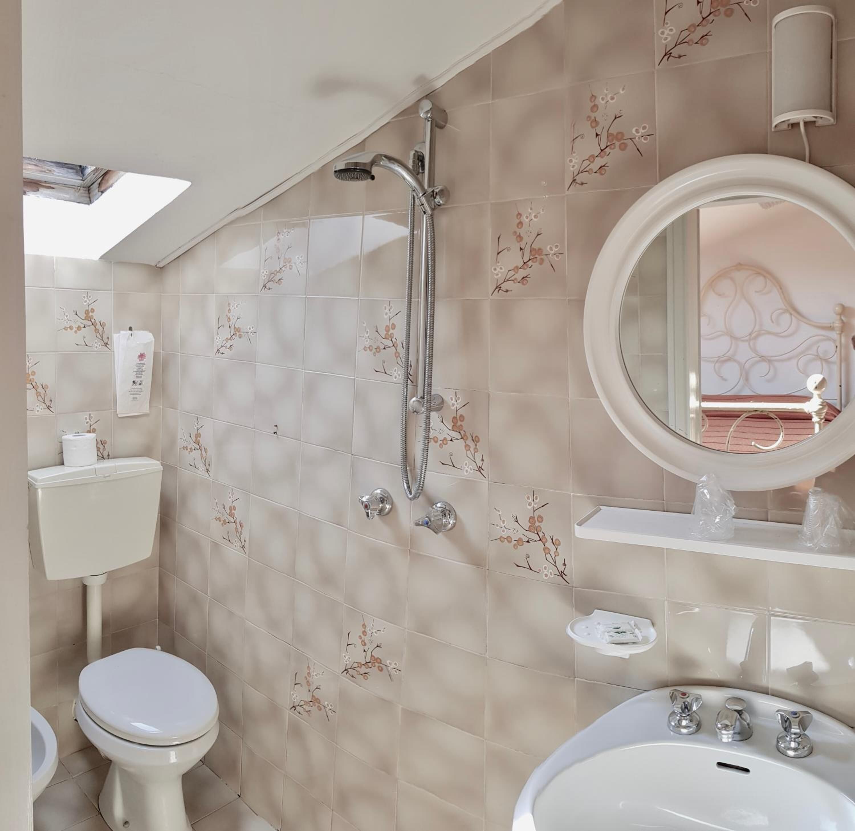 rainfall showerhead, hair dryer, bidet, towels