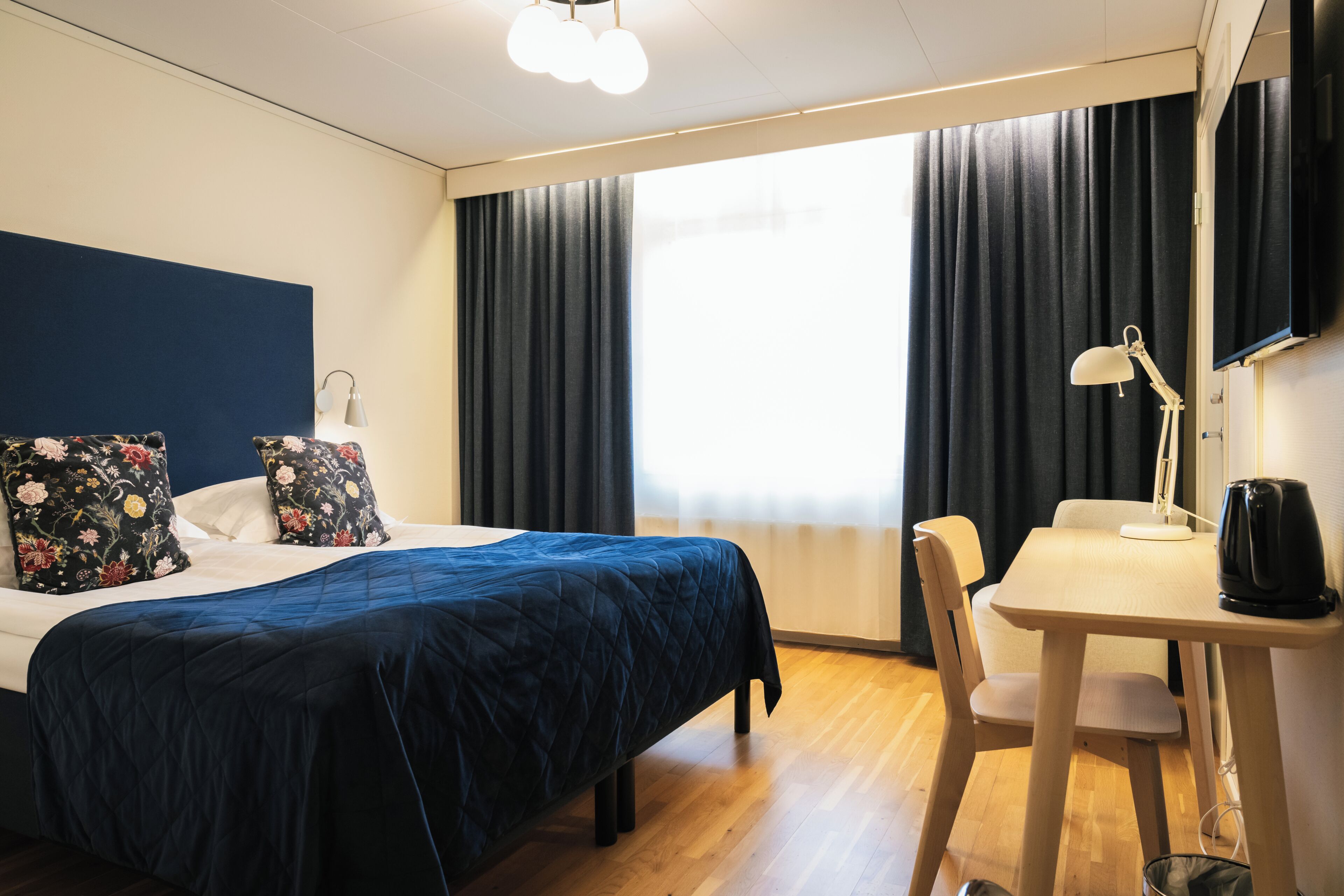 Individually decorated, individually furnished, desk, rollaway beds