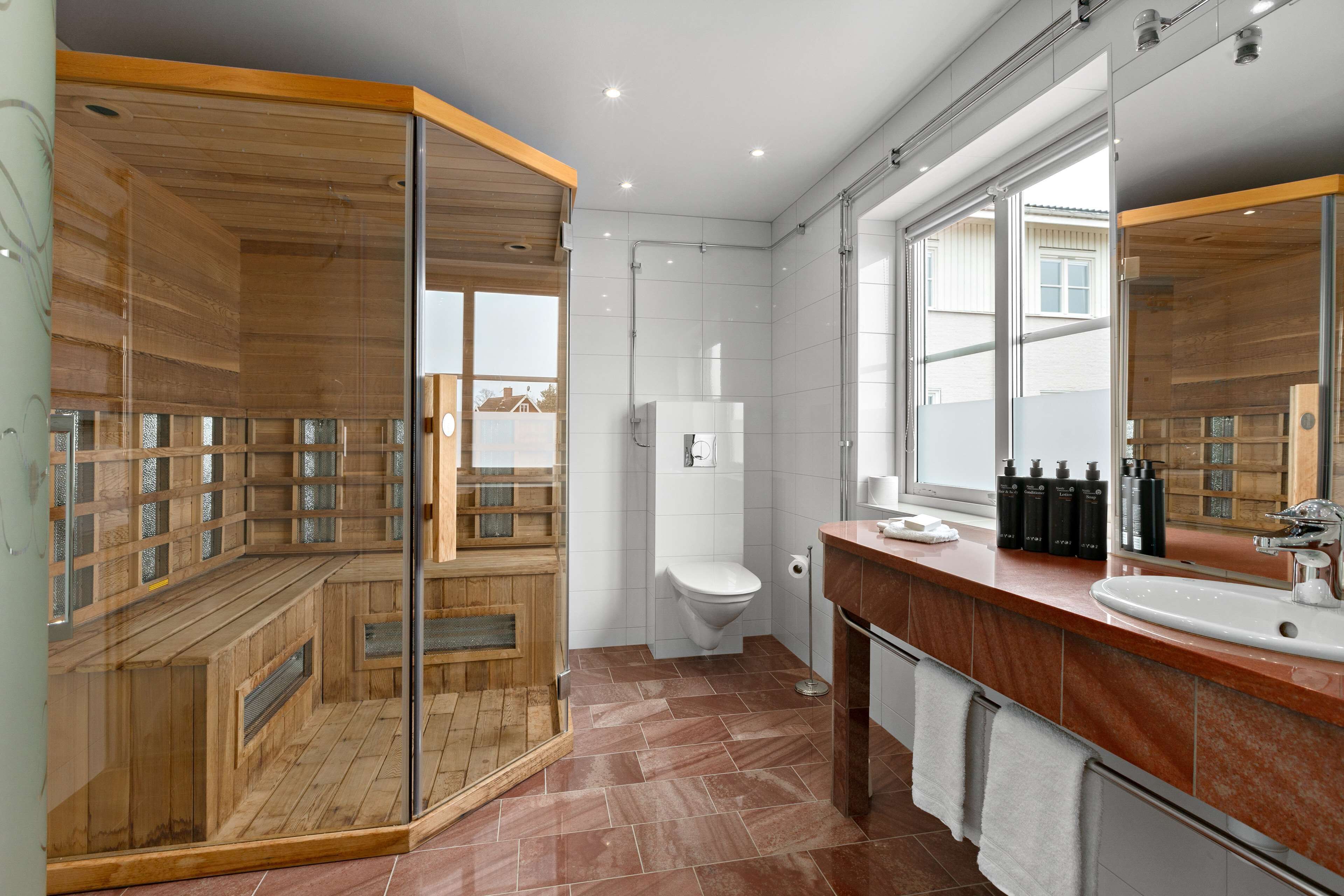 suite, 1 king bed, sauna, lake view | bathroom | hair dryer, towels