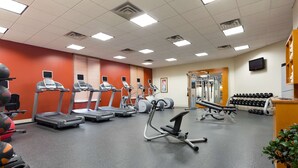 A gym with treadmills, elliptical machines, and free weights. - Hilton Garden Inn Bartlesville (Bartlesville)