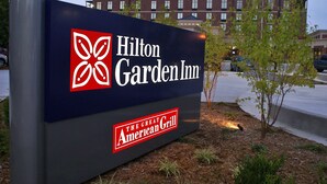 A Hilton Garden Inn sign with a logo and the name of the hotel. - Hilton Garden Inn Bartlesville (Bartlesville)