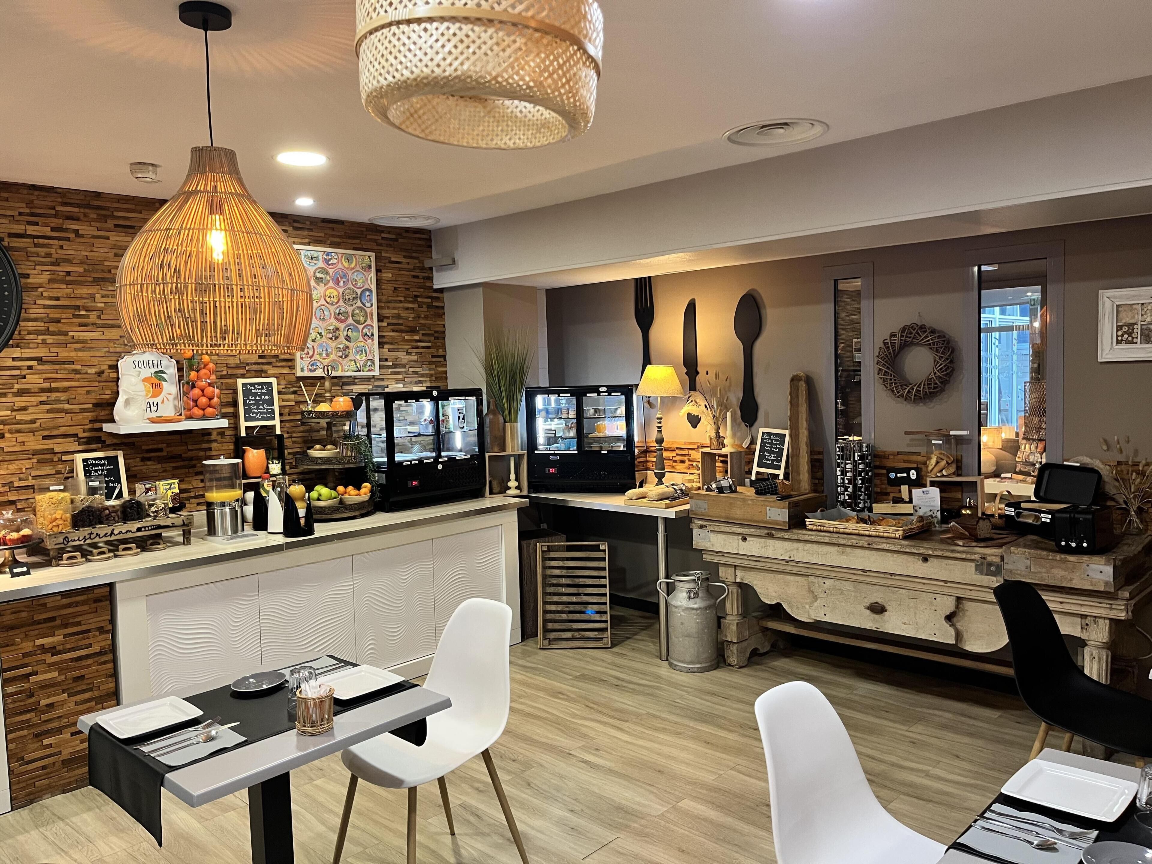 A modern kitchen with a bar area, wooden accents, and a dining setup.