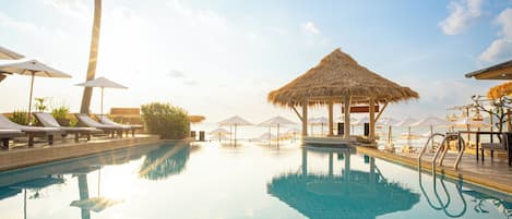 Outdoor pool, open 8 AM to 8 PM, pool umbrellas, sun loungers