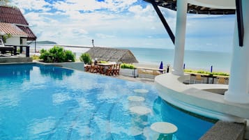 Outdoor pool, open 8 AM to 8 PM, pool umbrellas, sun loungers