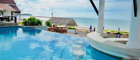 Outdoor pool, open 8 AM to 8 PM, pool umbrellas, pool loungers