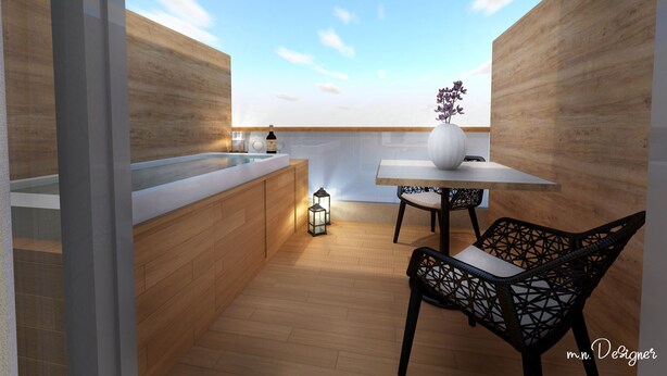 Una cocina moderna con encimera de madera, una mesa de comedor con un florero y una silla.