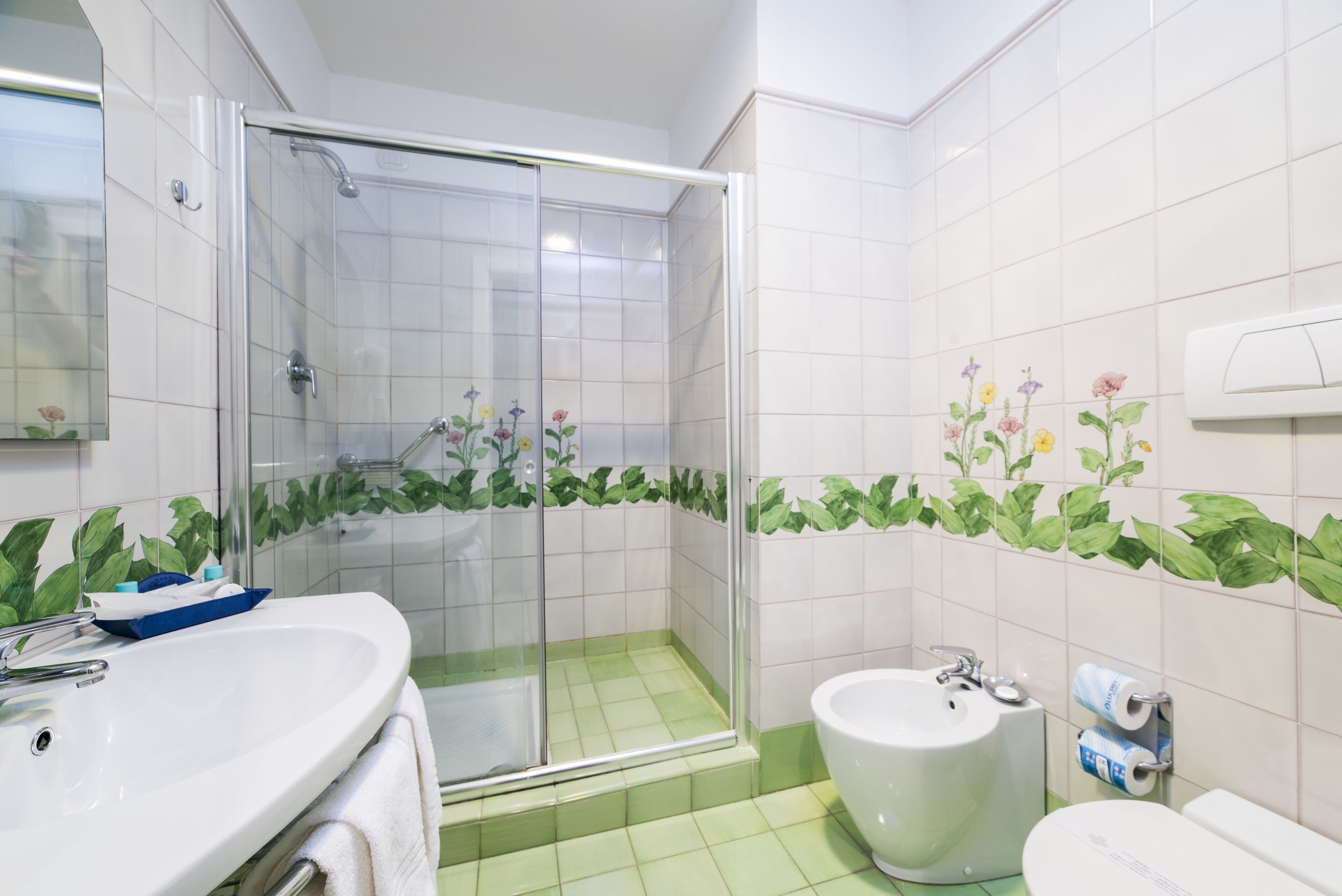 deluxe room, partial sea view | bathroom | shower, hair dryer, slippers, towels