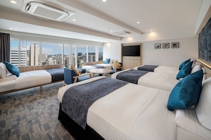 A hotel room with two beds, a TV, a small table, and a view of the city. - Hotel MyStays Nagoya - Sakae (Nagoya)