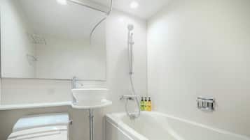 A modern bathroom with a white sink, a bathtub, and a shower.