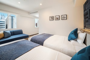 A hotel room with two beds, a sofa, and a large window. - Hotel MyStays Nagoya - Sakae (Nagoya)