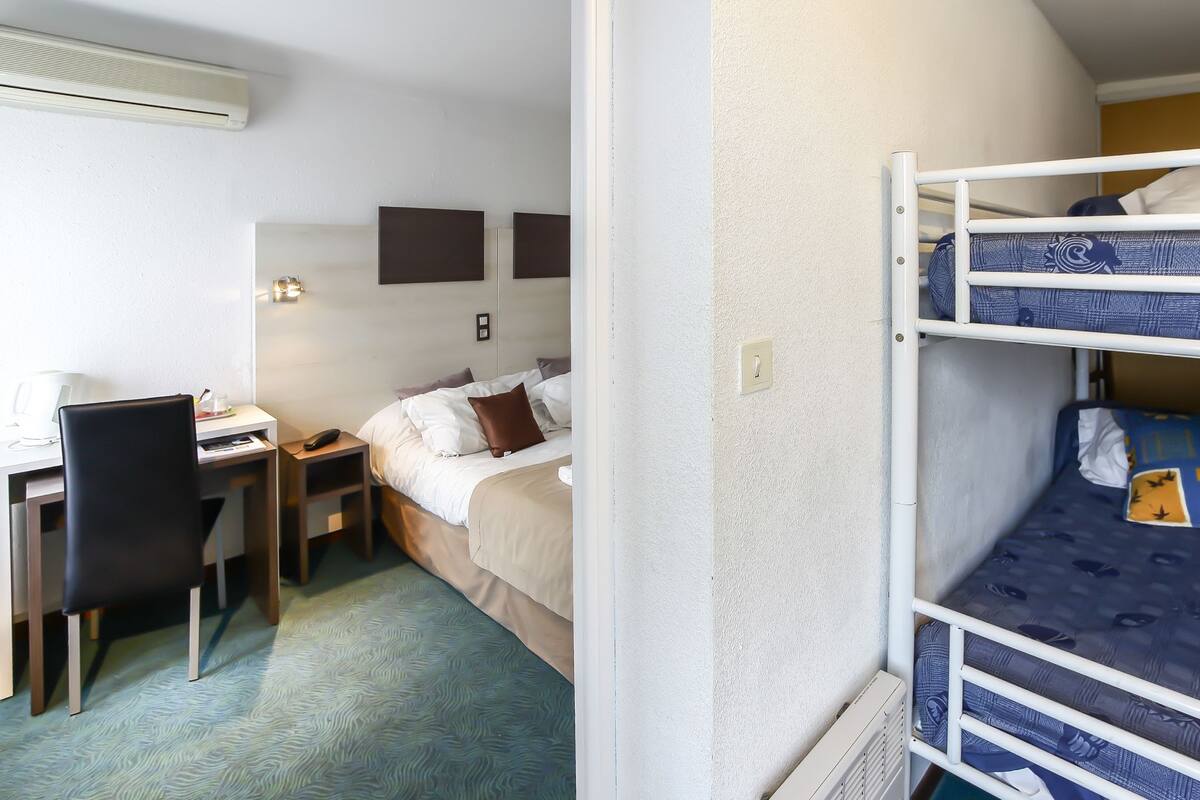 Family Room (2 adults & 2 children) | In-room safe, desk, blackout drapes, cribs (free)