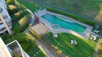 Outdoor pool, open 6:00 AM to 10:00 PM, pool umbrellas, pool loungers