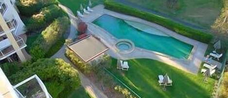 Outdoor pool, open 6:00 AM to 10:00 PM, pool umbrellas, pool loungers