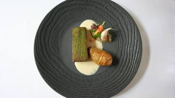 A round black plate with a textured surface.