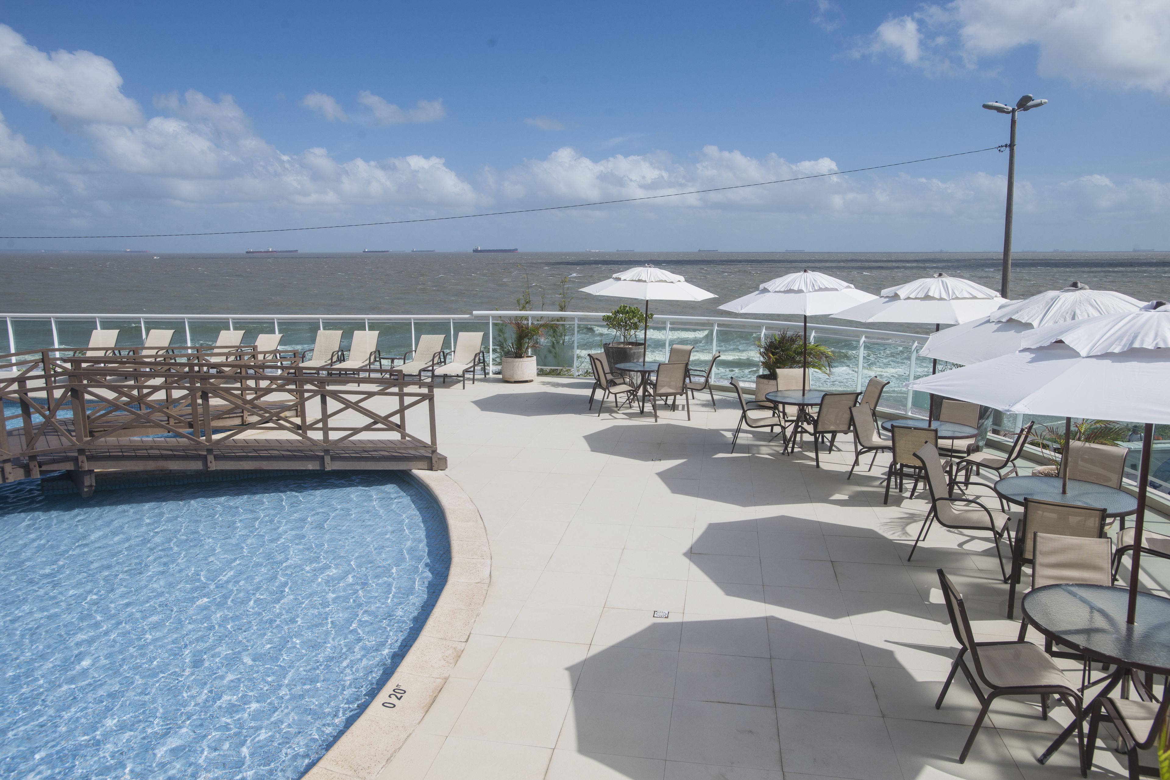 outdoor pool, open 8 am to 9 pm, pool umbrellas