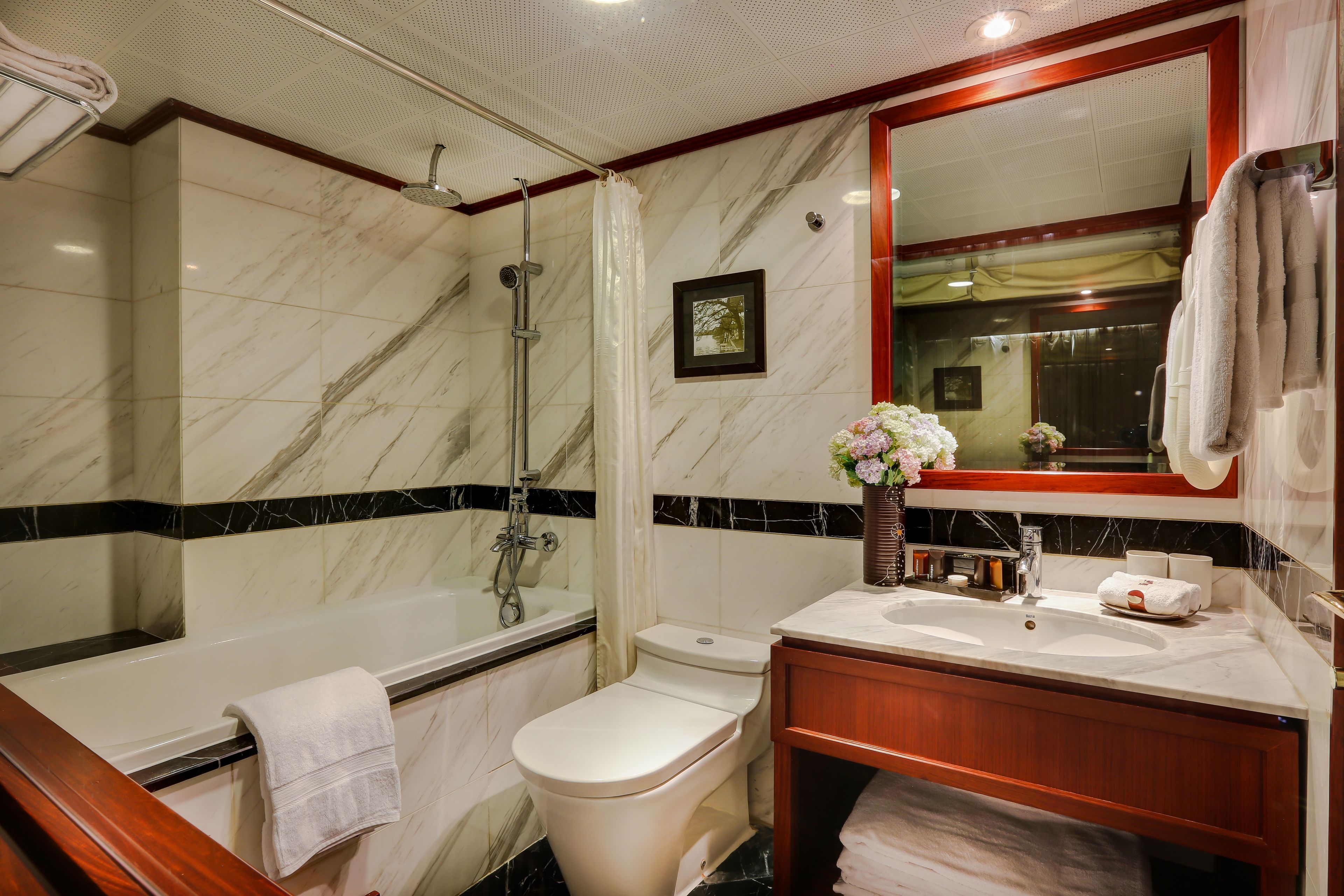 bathtub, designer toiletries, hair dryer, bathrobes