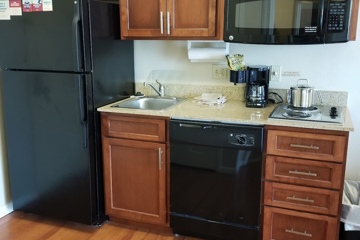 full-sized fridge, microwave, stovetop, dishwasher