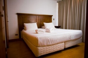 Premium bedding, down duvets, in-room safe, desk